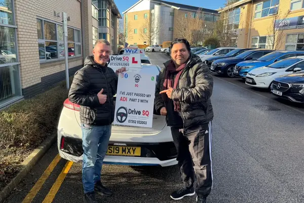 Learner and DriveSQ instructor celebrating a test pass