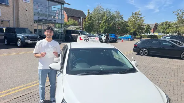 New driver with their pass certificate outside the test centre