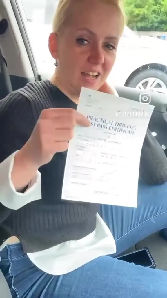 Video still: Pass certificate in hand